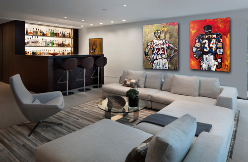Pair of paintings of Michael Jordan and Walter Payton seen from behind, hung above a sectional in a modern lounge